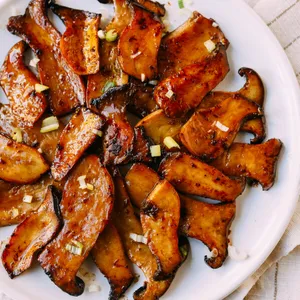 Vegan BBQ mushrooms, crisps, and garlic greens