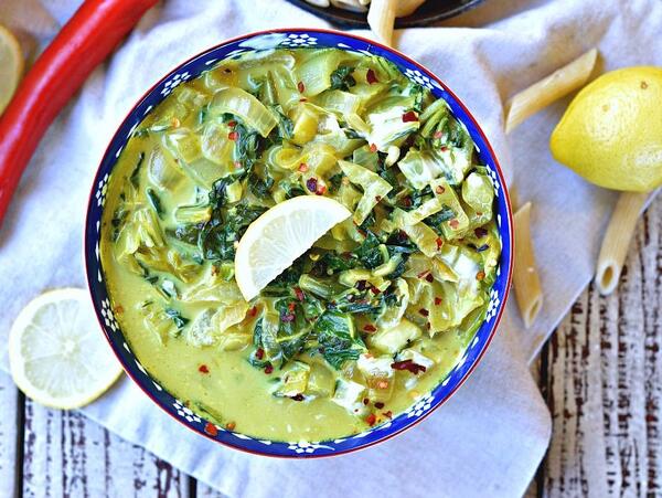 A bowl of Vegan Bok Choy Indian Curry on top of a napkin